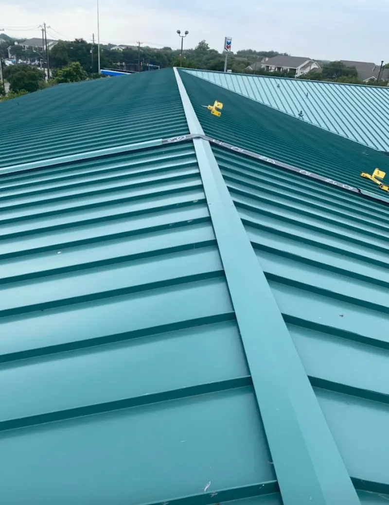 Green commercial metal roof ridge and valley for Metal Roof Repair in East Rockaway