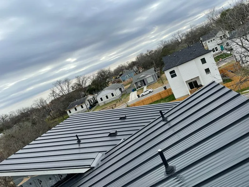 Standing seam metal roof panels with vents for Skylight Repair in East Rockaway